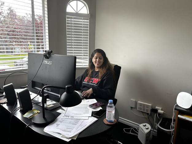 Administrator of an office behind the computer.